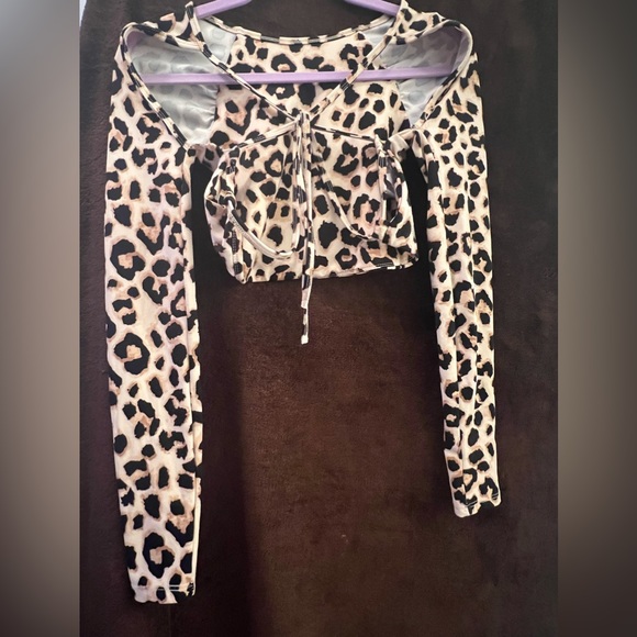 One of my favorite pieces . A crop leopard print with back tie strap down - Picture 1 of 2